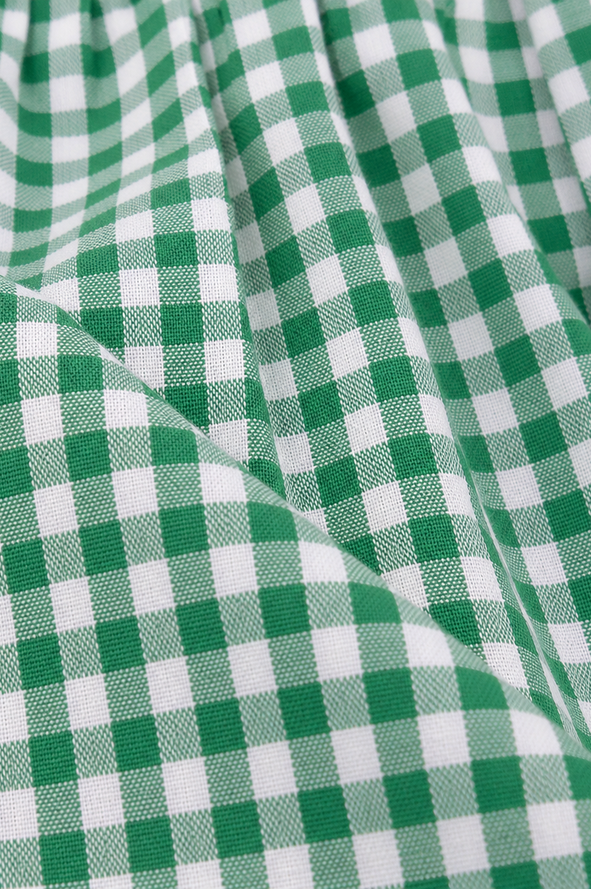 Detailaufnahme der Schürze vom Kinderdirndl Nele grün