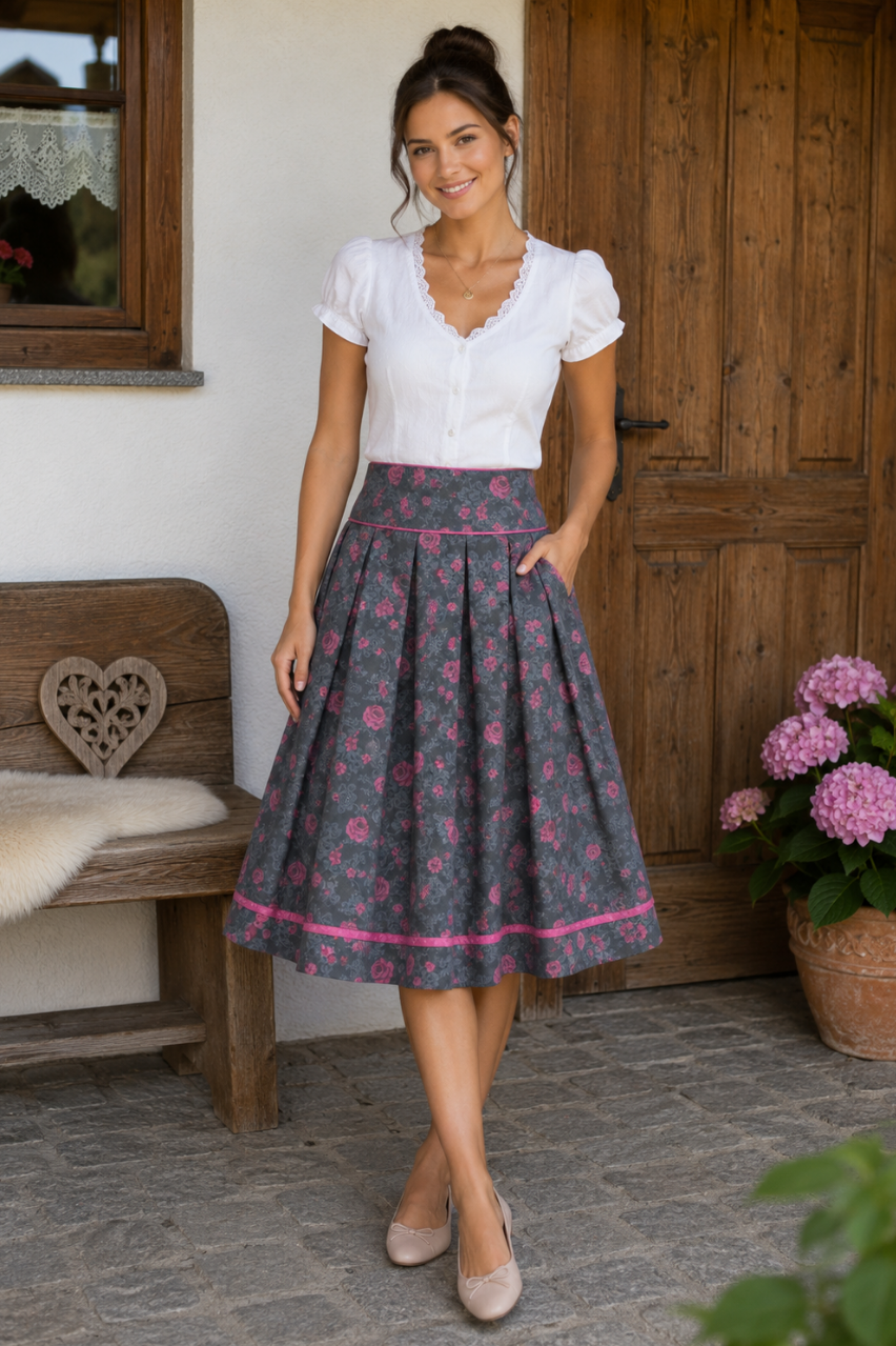 rachtenrock Anne aus dunkelgrauer Baumwolle mit rosa Rosenmuster und 65 cm Rocklänge.