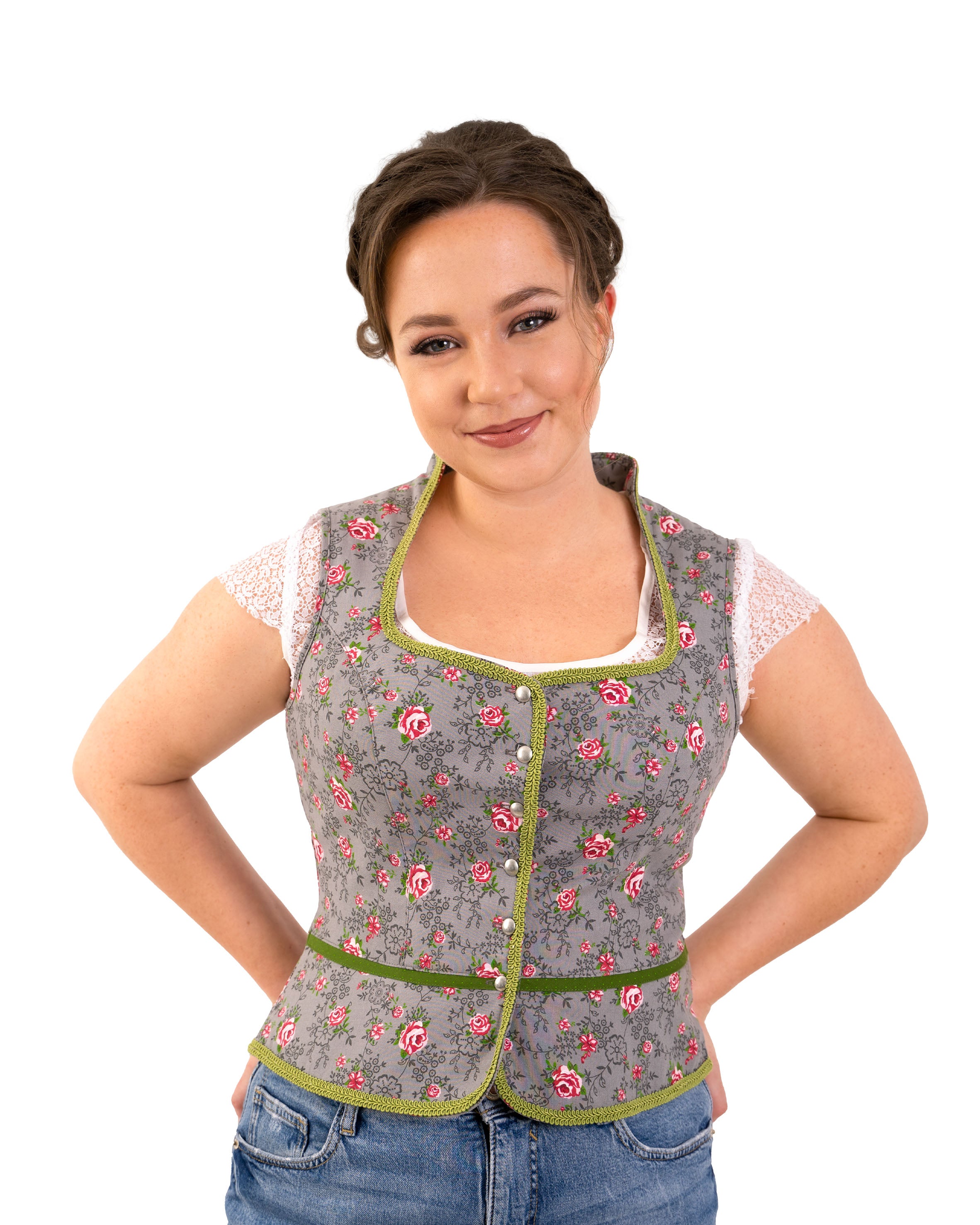 Trachtenmieder Leonie aus grauer Baumwolle mit rosa Rosenmuster, grünen Zierborten und dekorativer Knopfleiste im traditionellen Trachtenstil.